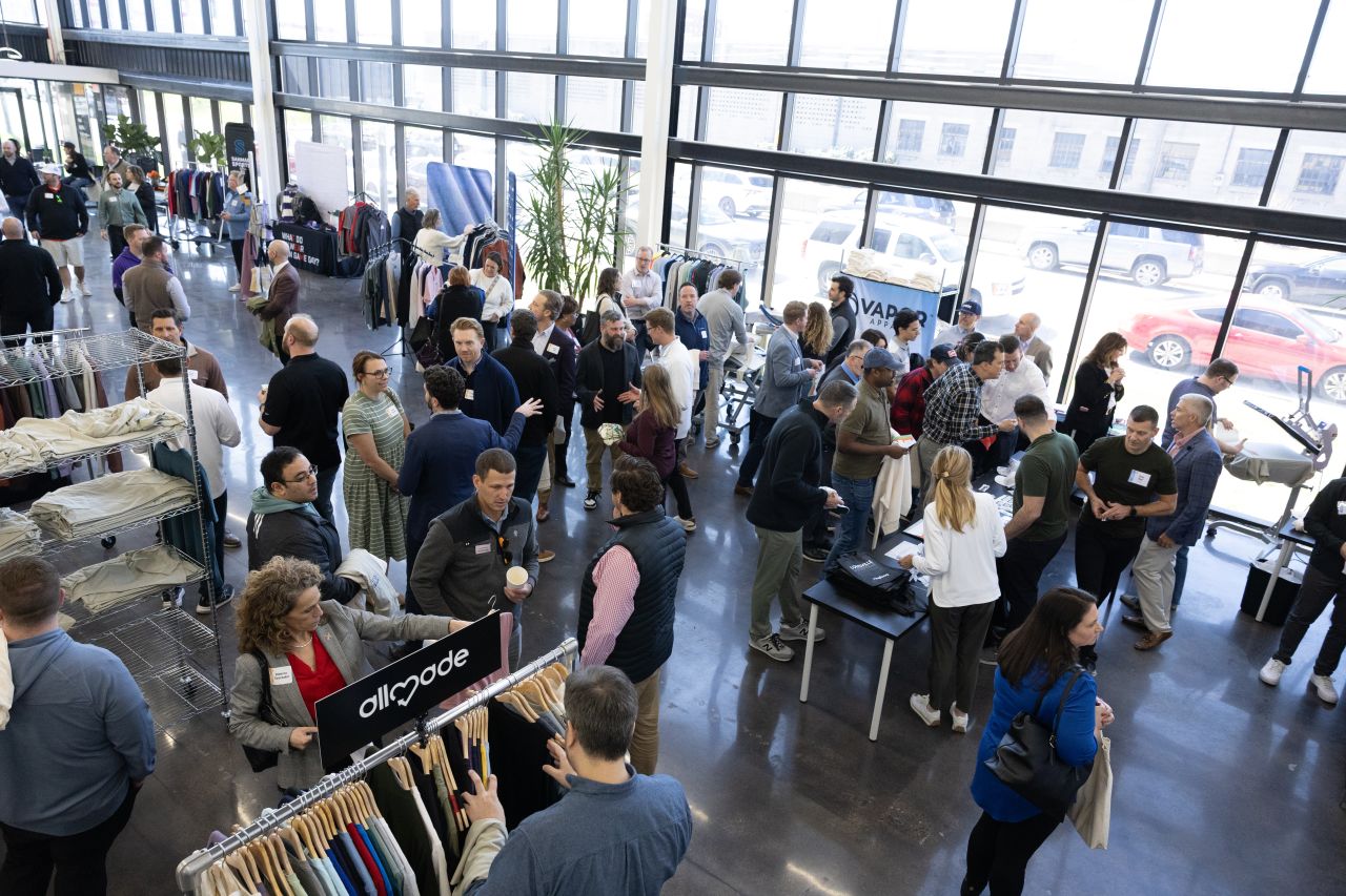 Guests browsing apparel racks on the Swag Factory floor