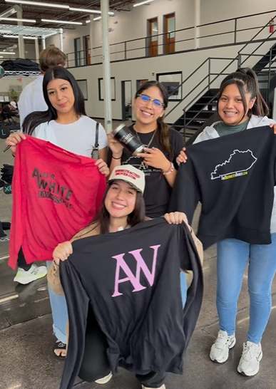 Team showing off their personalized shirts